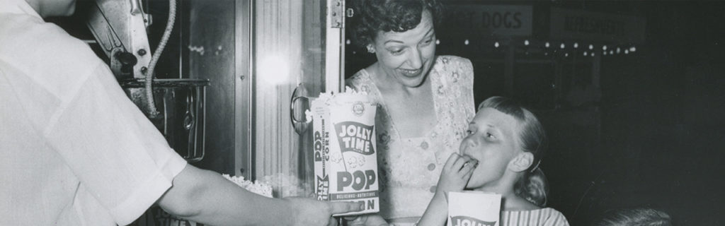 Vintage Image Of Family Enjoying Jolly Time Popcorn