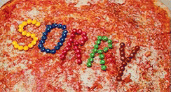 Short gif showing Michaeal from the Princess Diaries opening a box of pizza with the word SORRY spelled out in M&Ms. Make your movie night memorable with a theme of the Princess Diaries!